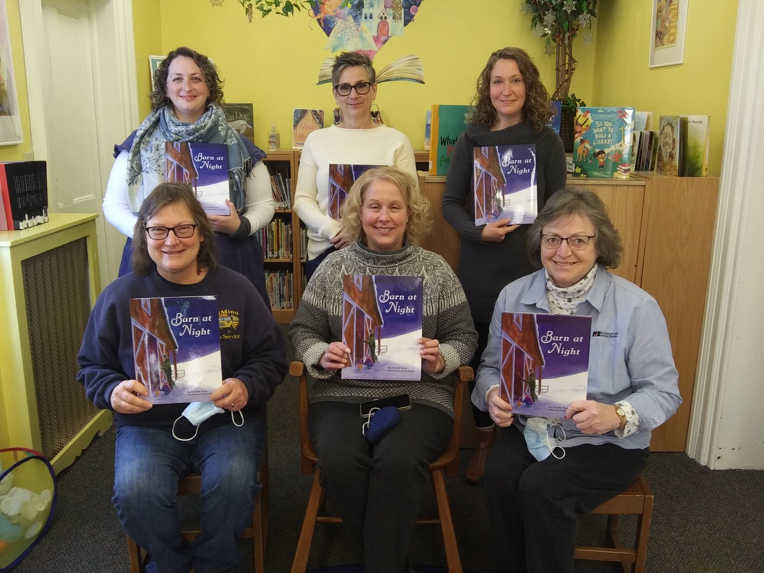 Staff from the Wayne/Pike Farm Bureau and from area libraries pose with copies of “Barn at Night.” Pictured, standing. are Jenny Snyder, left, Betty Lawson, and Allison Mowatt. Seated are Joyce Carson, left, Tracy Schwarz and Bonnie LaTourette. Not pictured are Kate Baxter, Kristina Russo, Amy Keane and Lynn Scramuzza...